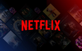 Netflix logo displayed in bold red lettering over a dark, shadowy background of streaming thumbnails.